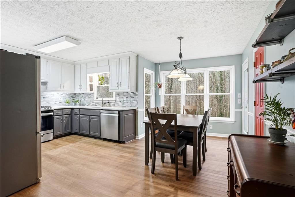 125 Cardinal Court Covington, GA 30016 - Photo 11 of 37 a view of a dining room with furniture window and wooden floor