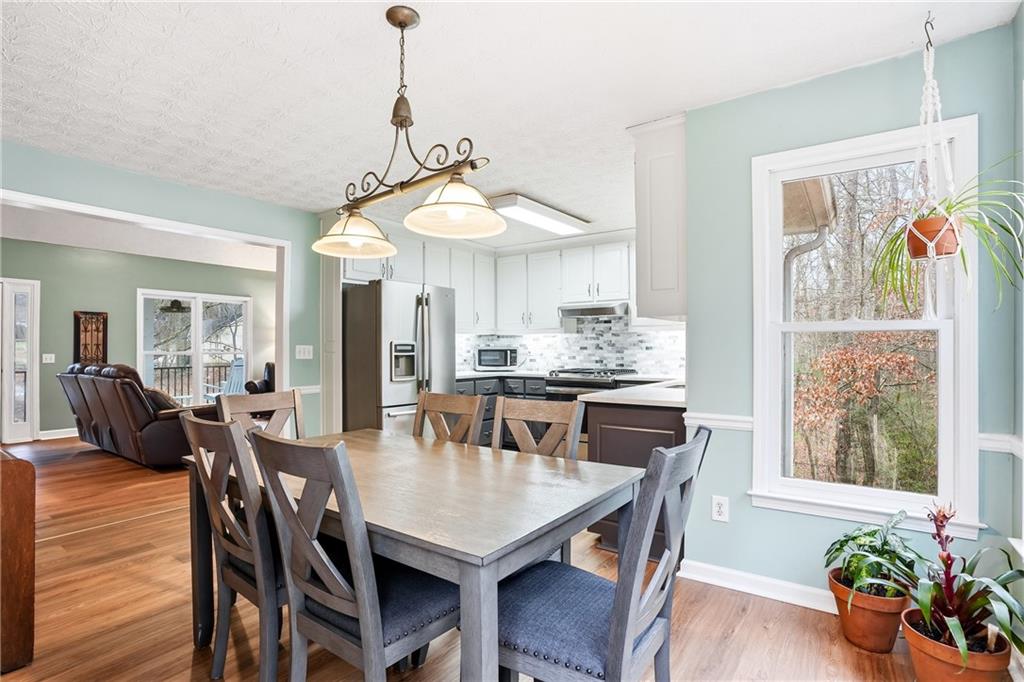 125 Cardinal Court Covington, GA 30016 - Photo 12 of 37 a view of a dining room with furniture window and wooden floor