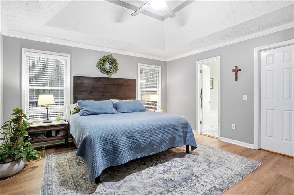125 Cardinal Court Covington, GA 30016 - Photo 15 of 37 a bedroom with a bed dresser and a window