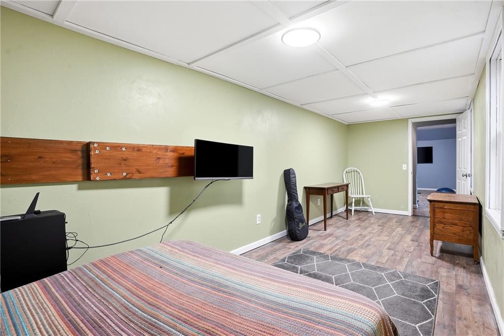 125 Cardinal Court Covington, GA 30016 - Photo 24 of 37 a bedroom with a bed and a television in it