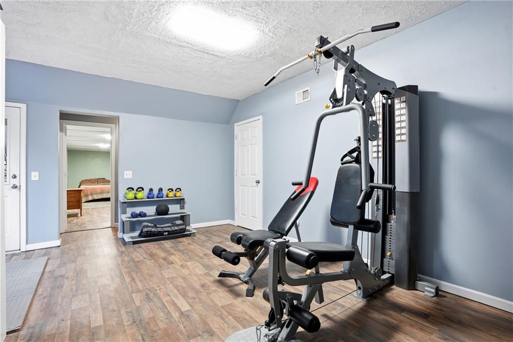 125 Cardinal Court Covington, GA 30016 - Photo 26 of 37 a view of a room with gym equipment