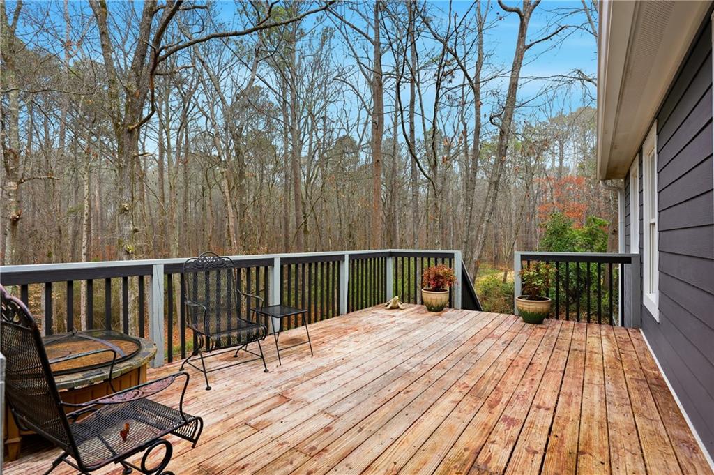 125 Cardinal Court Covington, GA 30016 - Photo 30 of 37 a view of balcony with wooden floor and fence