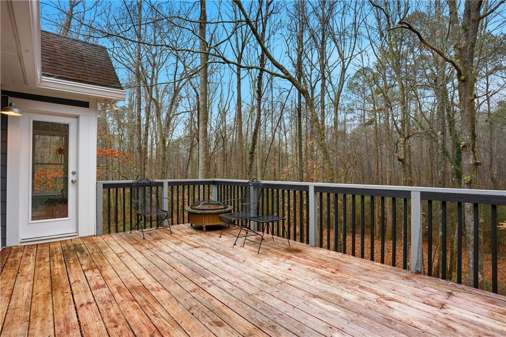 125 Cardinal Court Covington, GA 30016 - Photo 31 of 37 a view of balcony with wooden floor and fence
