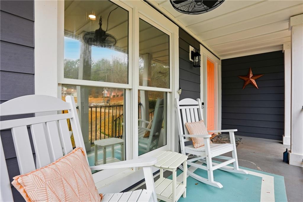 125 Cardinal Court Covington, GA 30016 - Photo 5 of 37 a balcony with table and chairs
