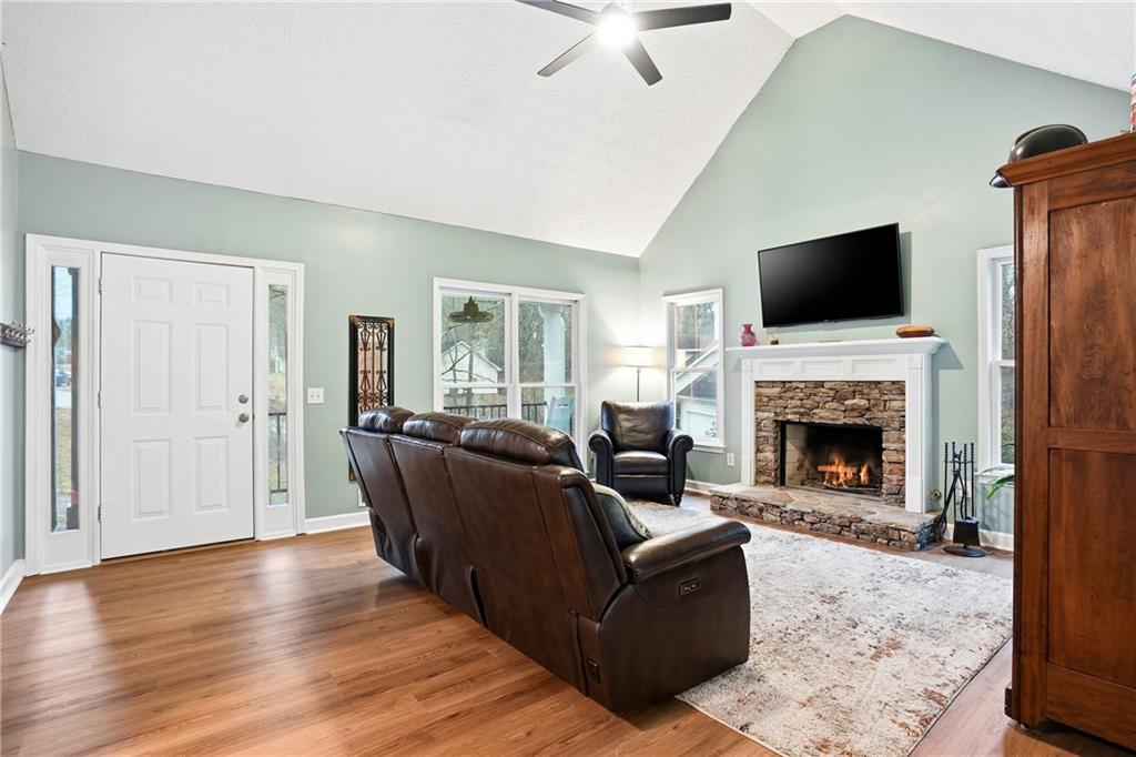 125 Cardinal Court Covington, GA 30016 - Photo 7 of 37 a living room with furniture a flat screen tv and a fireplace