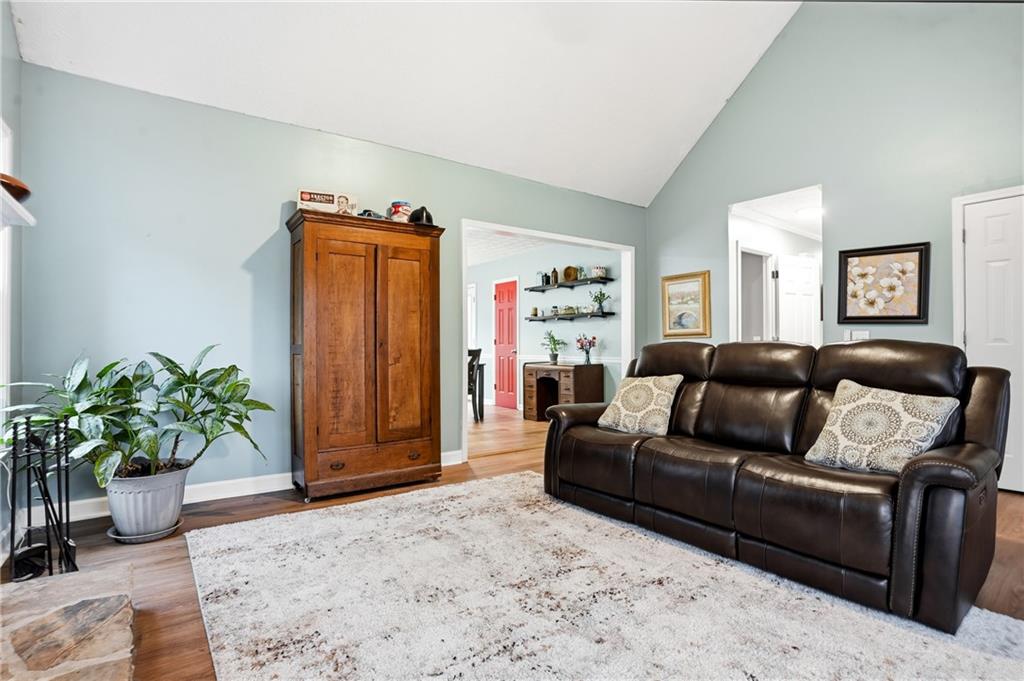 125 Cardinal Court Covington, GA 30016 - Photo 9 of 37 a living room with furniture and a potted plant