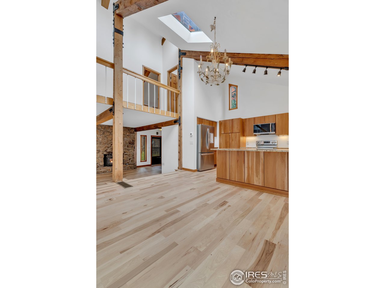 926 Mountain Meadows Road Boulder, CO 80302 - Photo 13 of 38 a view of a living room with kitchen and furniture
