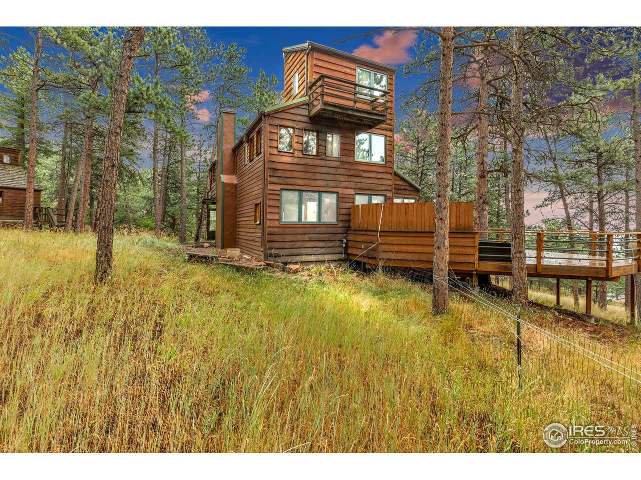 926 Mountain Meadows Road Boulder, CO 80302 - Photo 3 of 38 a view of a house with a swimming pool