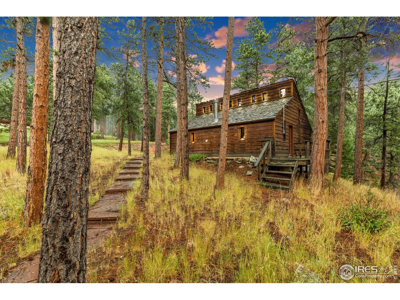 926 Mountain Meadows Road Boulder, CO 80302 - Photo 34 of 38 a swimming pool with outdoor seating and yard