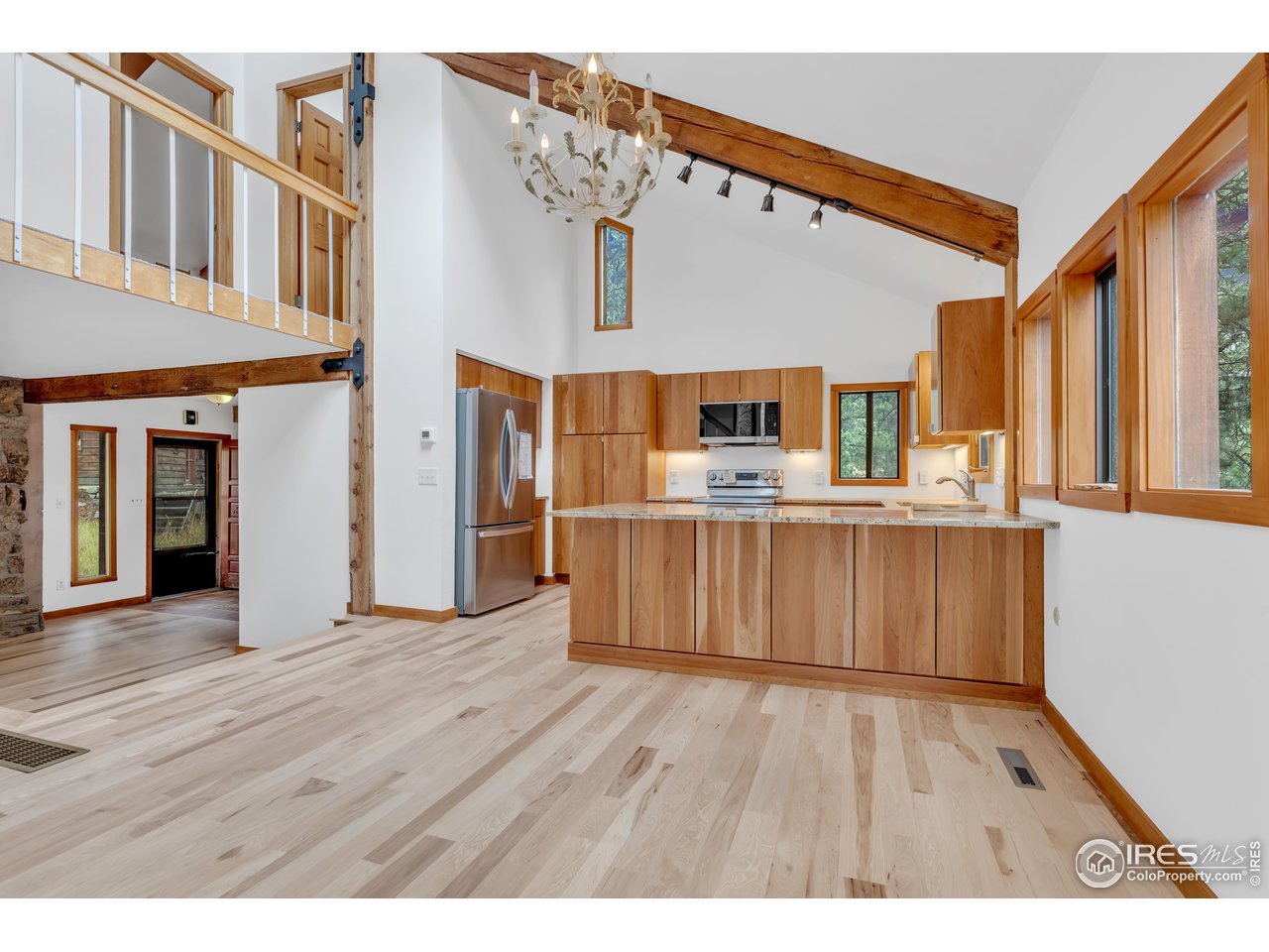 926 Mountain Meadows Road Boulder, CO 80302 - Photo 10 of 38 a view interior of kitchen and hall with wooden floor