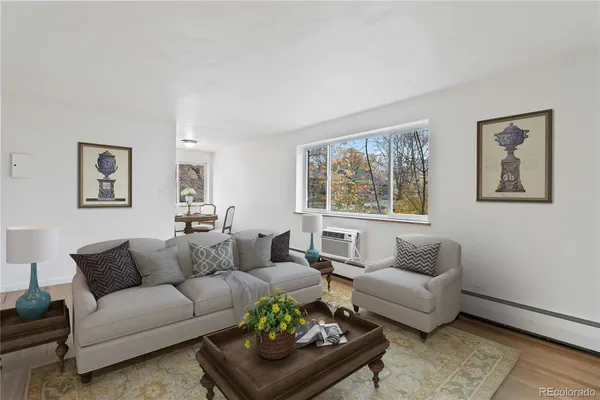 a living room with furniture and a window