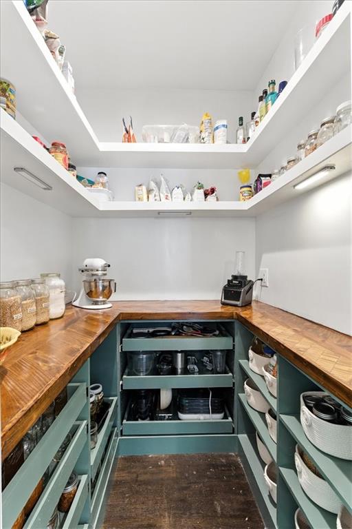120 Quarrington Court Milton, GA 30004 - Photo 12 of 48 a kitchen with stainless steel appliances a stove and wooden cabinets
