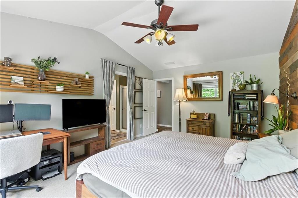 120 Quarrington Court Milton, GA 30004 - Photo 22 of 48 a bedroom with a bed and a flat screen tv