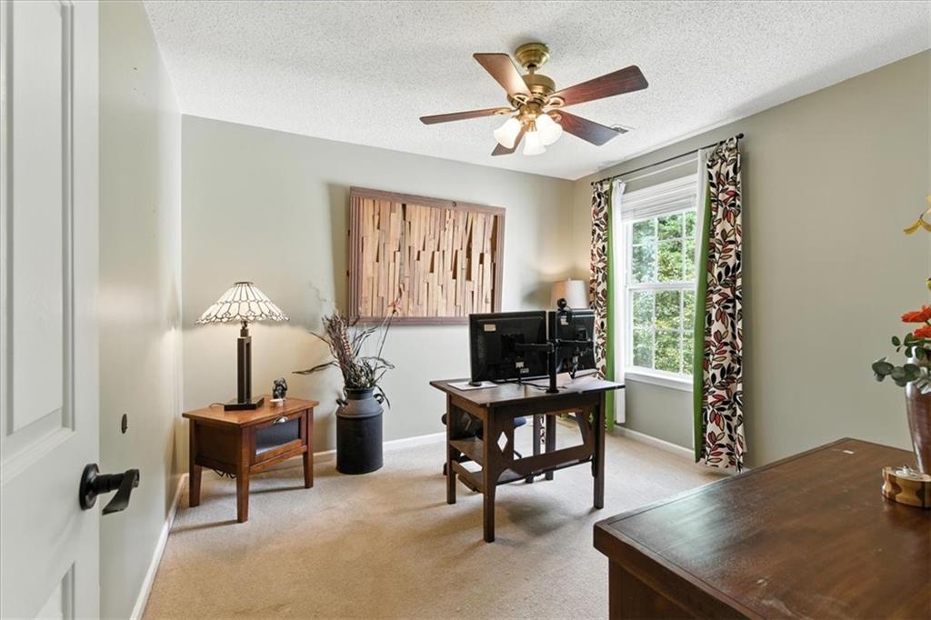 120 Quarrington Court Milton, GA 30004 - Photo 25 of 48 a workspace with furniture and a window