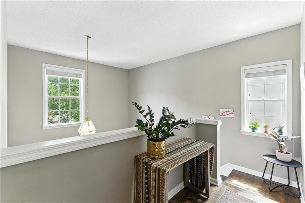 120 Quarrington Court Milton, GA 30004 - Photo 28 of 48 a view of a workspace with furniture and a potted plant