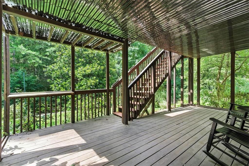 120 Quarrington Court Milton, GA 30004 - Photo 37 of 48 a view of balcony with wooden floor and fence