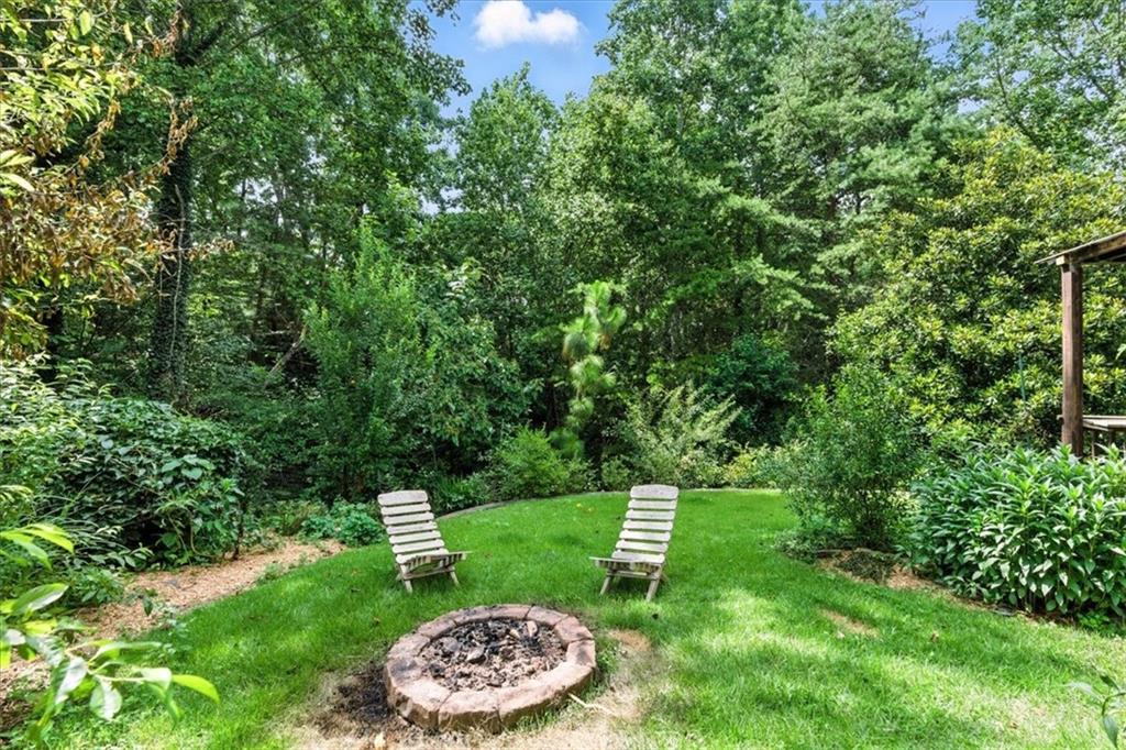 120 Quarrington Court Milton, GA 30004 - Photo 38 of 48 a view of a backyard with plants and trees
