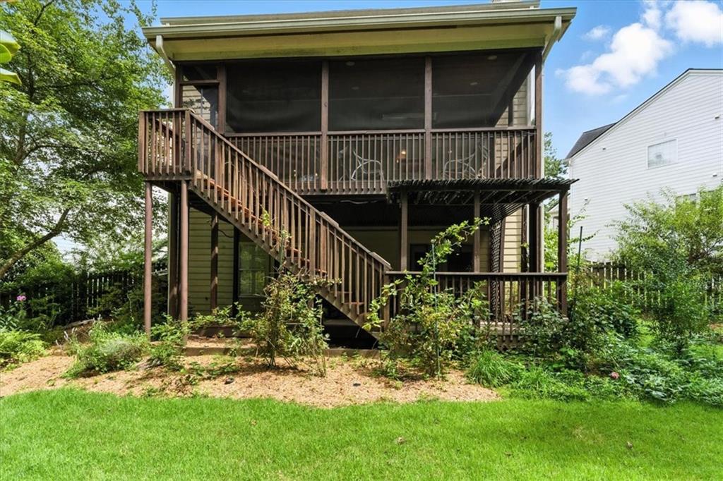 120 Quarrington Court Milton, GA 30004 - Photo 40 of 48 a view of a house with a large window and stairs