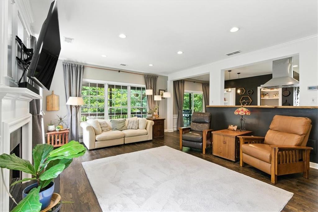 120 Quarrington Court Milton, GA 30004 - Photo 5 of 48 a living room with furniture flat screen tv and a large window