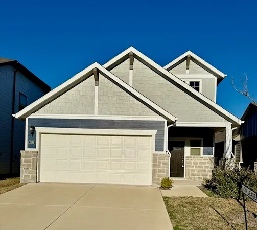 a view of house with garage
