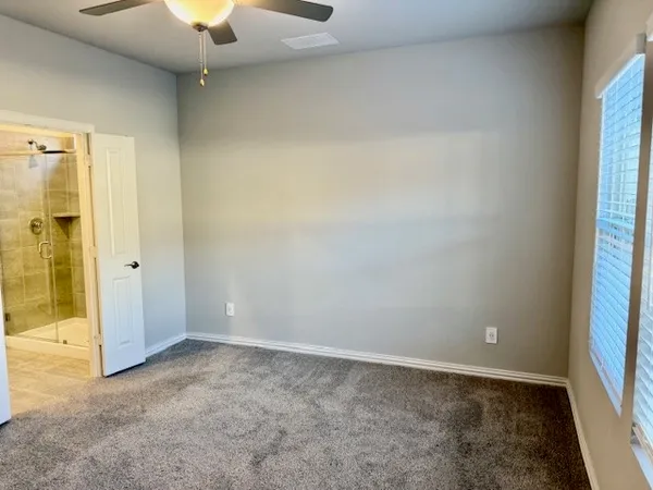 an empty room with a empty space and a window