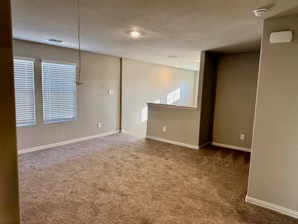 a view of an empty room and window