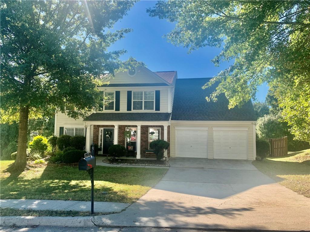 front view of a house with a yard