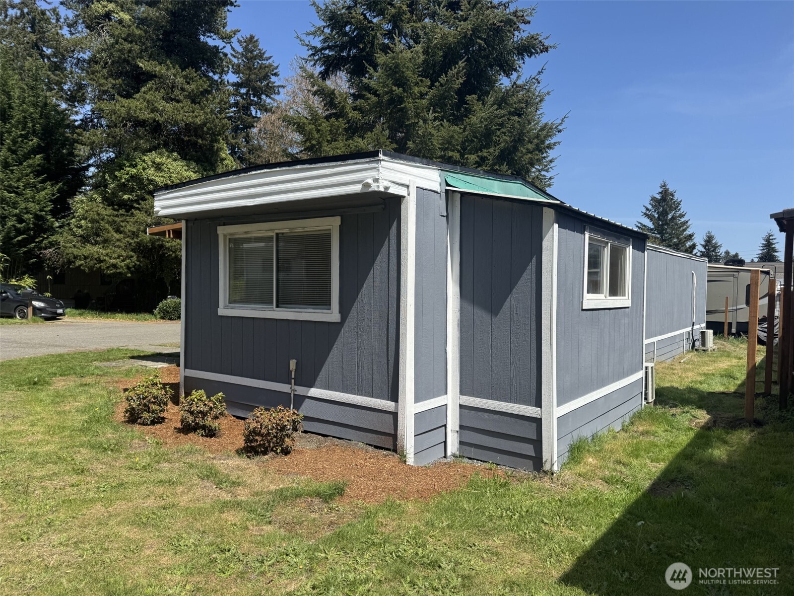 a view of backyard with cabin