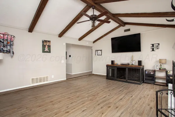 a view of livingroom with furniture and flat screen tv
