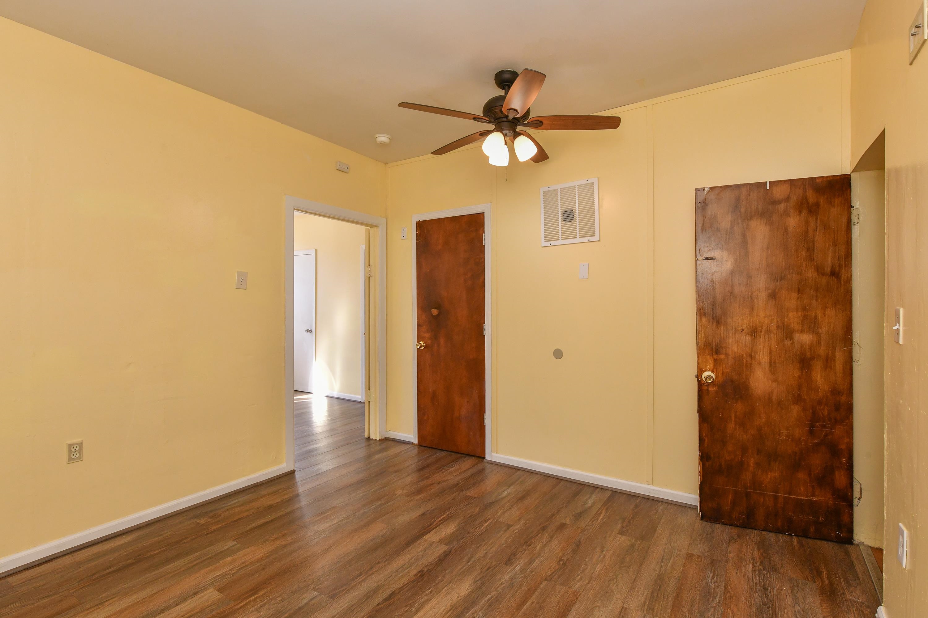 208 4th Street, Unit 1 Passaic, NJ 07055 - Photo 12 of 28 a view of a livingroom with wooden floor and a ceiling fan