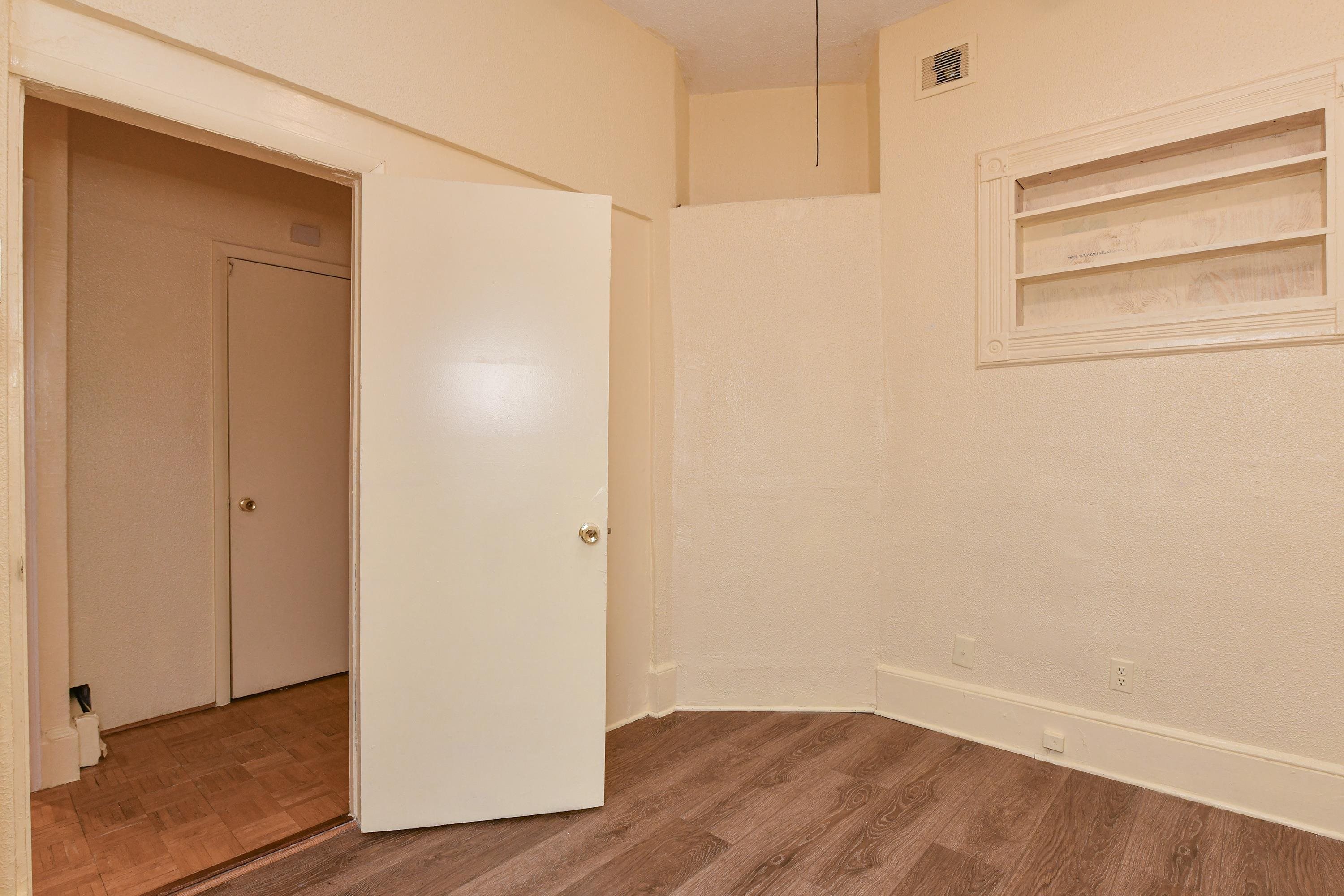 208 4th Street, Unit 1 Passaic, NJ 07055 - Photo 19 of 28 a view of an empty room with wooden floor