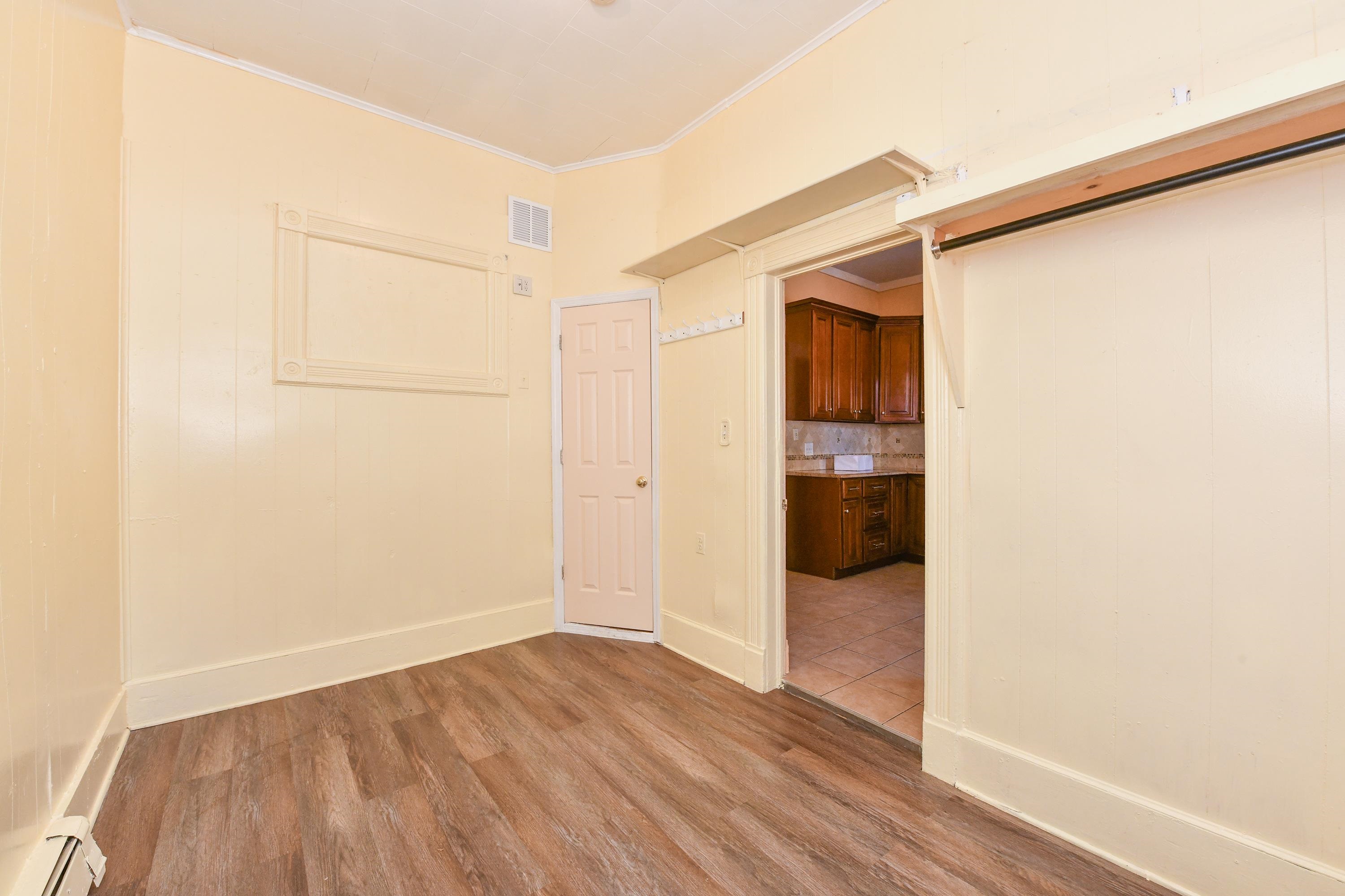 208 4th Street, Unit 1 Passaic, NJ 07055 - Photo 22 of 28 a view of a big room with wooden floor and entryway