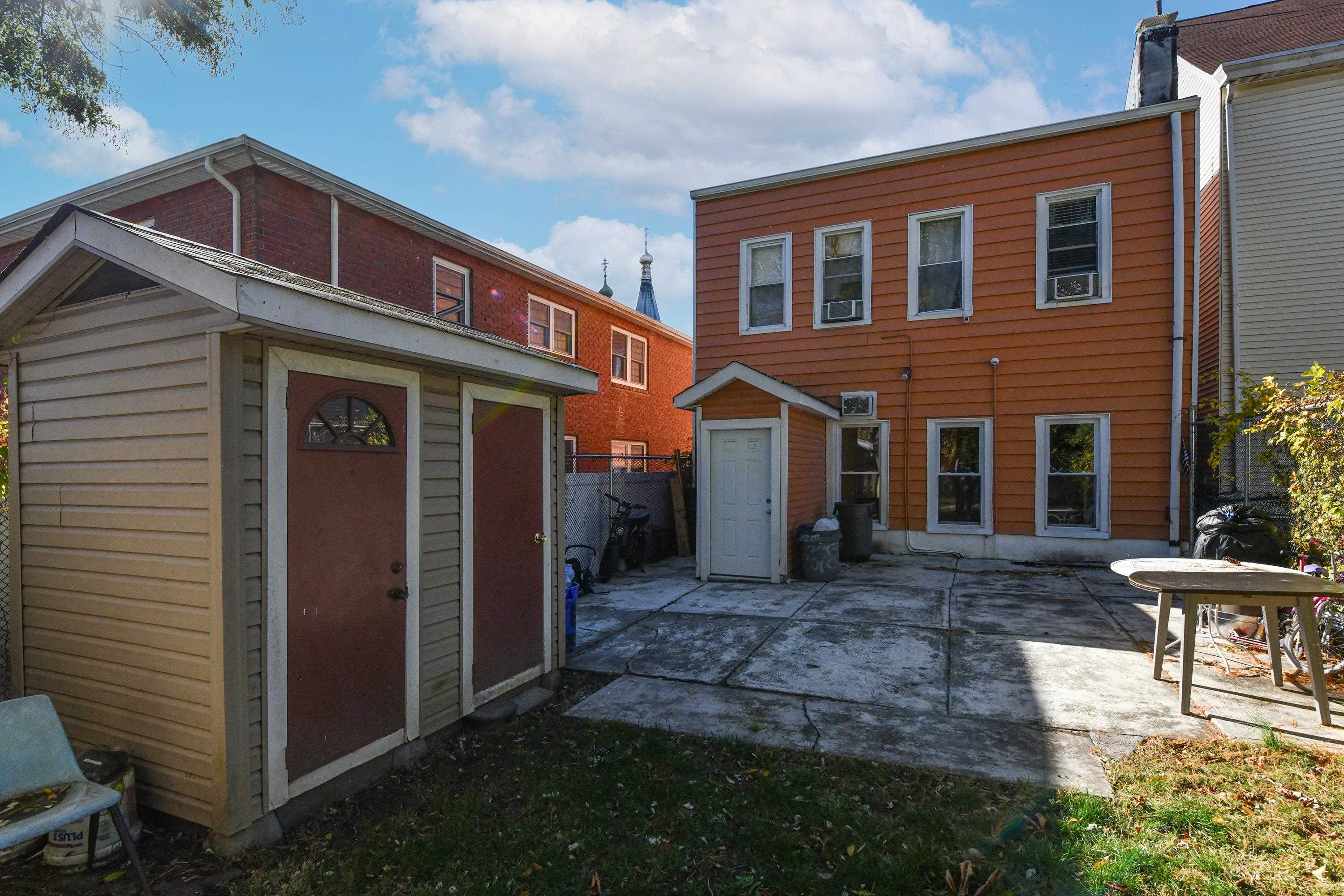 208 4th Street, Unit 1 Passaic, NJ 07055 - Photo 24 of 28 a front view of a house with garden