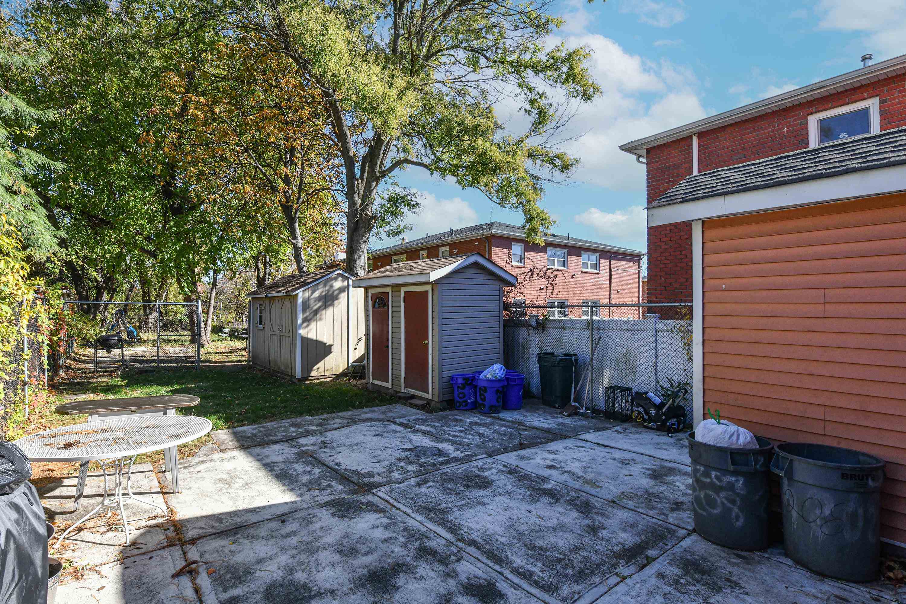 208 4th Street, Unit 1 Passaic, NJ 07055 - Photo 25 of 28 a view of backyard with large tree and wooden fence