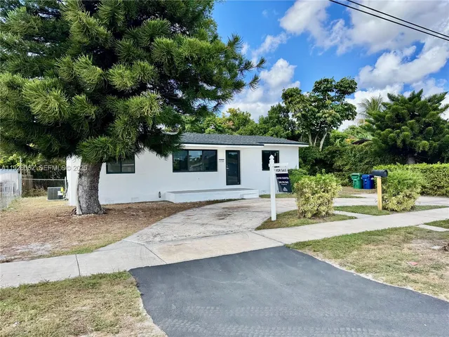 a house with trees in the background