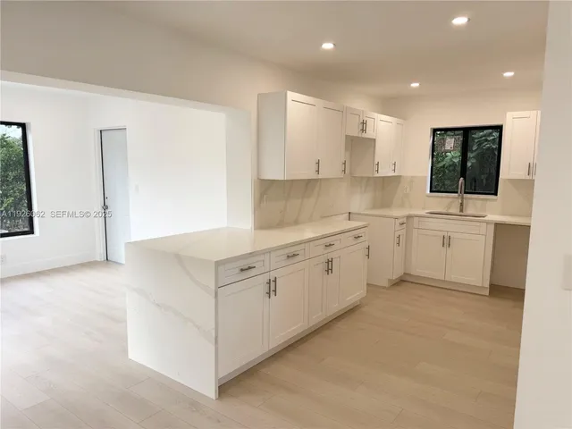 an empty room with a empty space and window