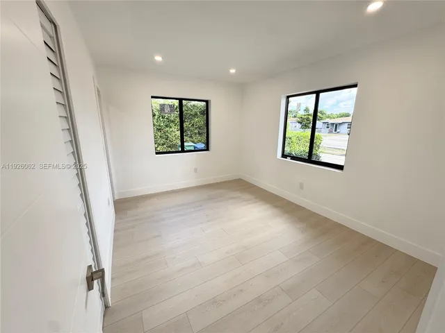 a bathroom with a granite countertop toilet sink and shower