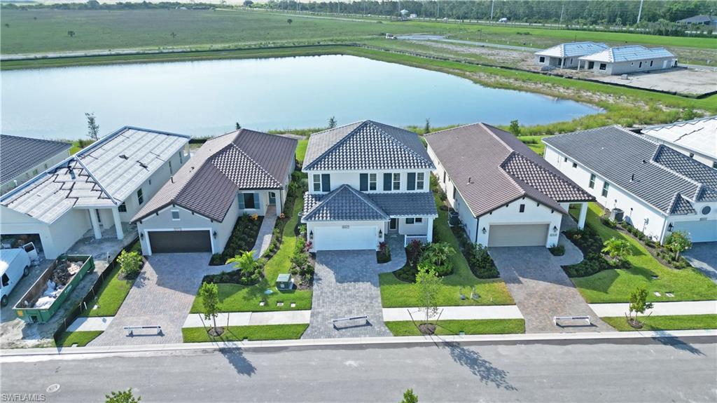 4652 Centaurus Circle Naples, FL 34120 - Photo 42 of 45 Aerial view of residential area with a nearby body of water
