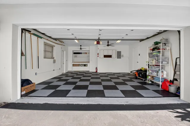 a black and white checkered floor with lots of white walls