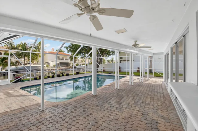 a view of a swimming pool with a patio