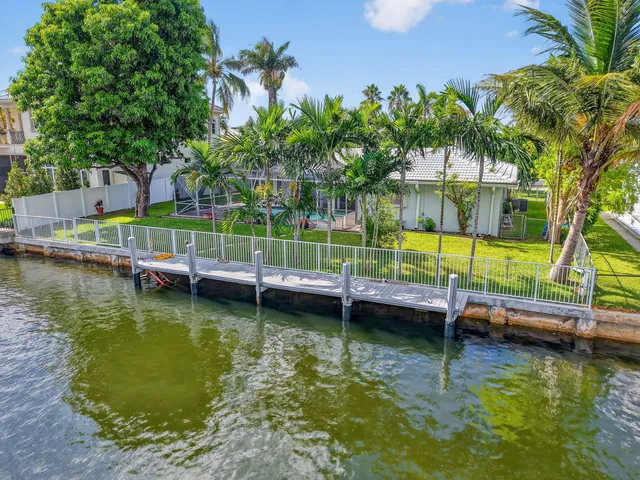 a view of a house with swimming pool and a garden