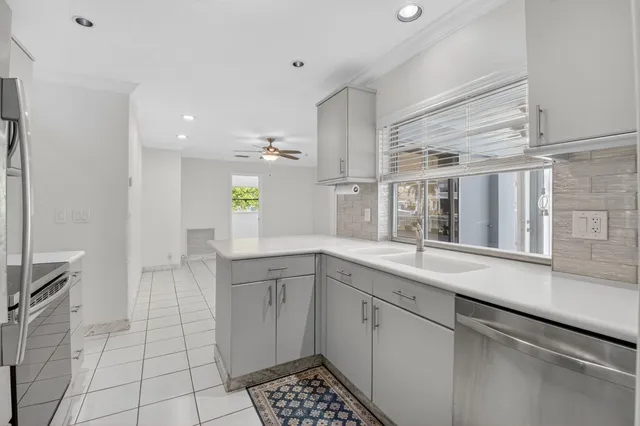 a kitchen with a sink and cabinets