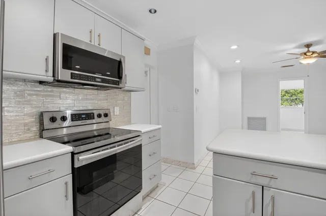 a kitchen with a stove and a microwave