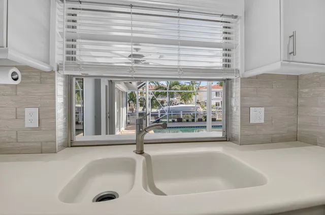 a bathroom with a tub a sink and a shower