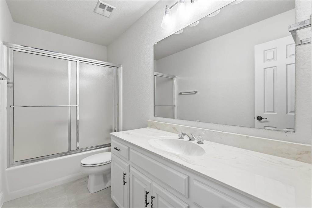 19 Timbergreen Circle Denton, TX 76205 - Photo 27 of 40 a bathroom with a sink toilet and shower