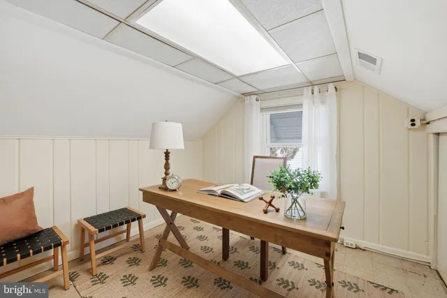 a view of a workspace with furniture