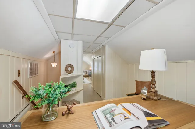 a workspace with furniture and a wooden floor