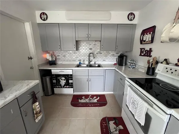 a kitchen with a sink and cabinets