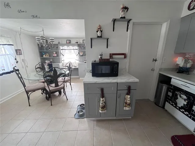 a kitchen with a stove and a microwave