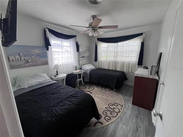 a bedroom with double bed and a window